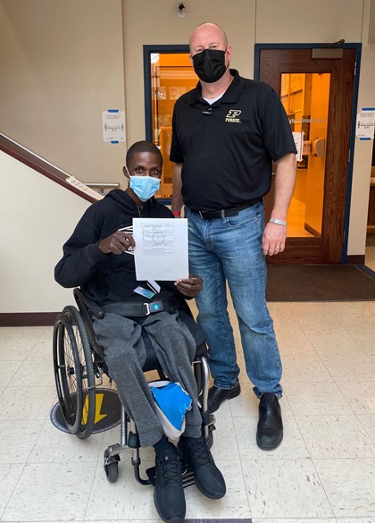 U.S. Army veteran T'angelo Magee, pictured with designated pilot examiner Brian Dillman, served seven tours before becoming paralyzed in an accident. He earned his sport private certificate after training with Able Flight. Photo courtesy of Able Flight.
