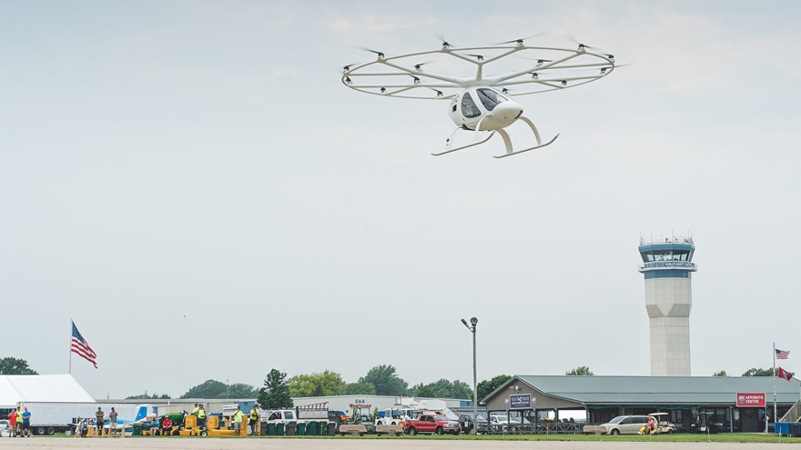 The Volocopter 2X prototype flew briefly over Wittman Regional Airport in Oshkosh, Wisconsin, July 27, staking a claim as the first crewed, electric vertical takeoff and landing flight in public in the United States. Photo courtesy of Volocopter.