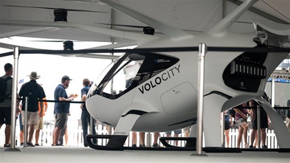 Visitors to Volocopter’s exhibit at EAA AirVenture were given a chance to try a VoloCity model on for size. Photo courtesy of Volocopter.