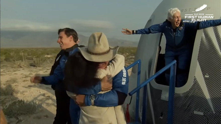 Wally Funk emerges from the capsule with her arms outstretched. Image courtesy of Blue Origin via YouTube.