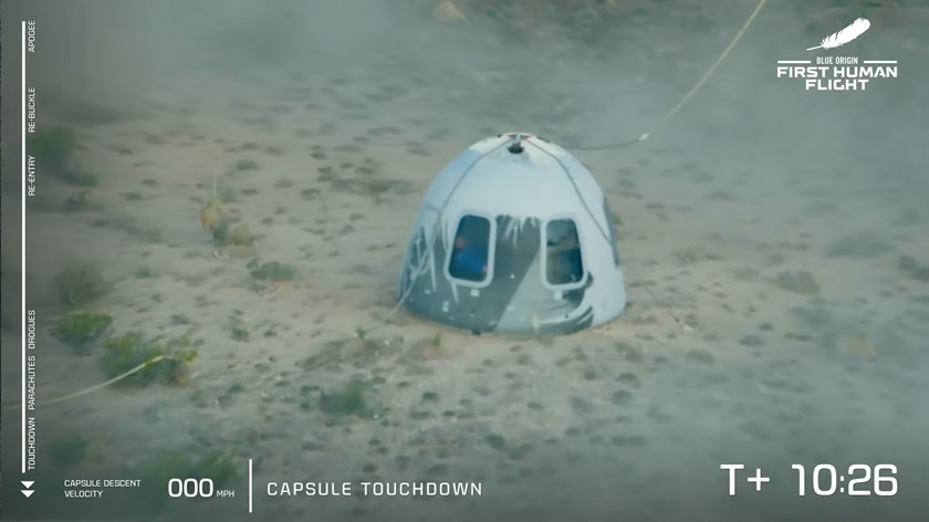 The New Shepherd capsule touched down softly under parachutes, with a short blast of rocket power to soften the landing. Image courtesy of Blue Origin via YouTube.