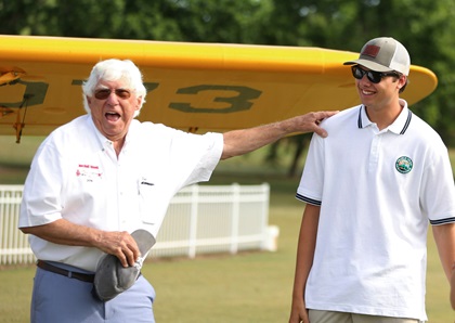 Triple Tree Aerodrome founder Pat Hartness jokes with teen pilot Ben Templeton in Woodruff, South Carolina. Photo courtesy of Triple Tree Aerodrome.                                                                                                                           
