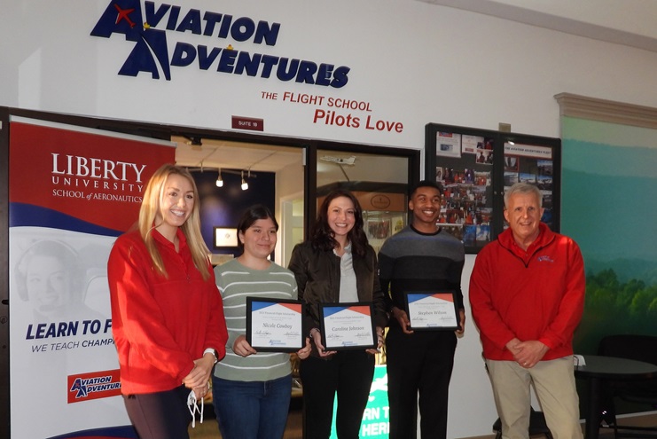 Three Aviation Adventures students are sharing $7,000 in awards to help them complete their private pilot training. Nicole Cowboy, Caroline Johnson, and Stephen Wilson are framed by Aviation Adventures' Abby Welch, left, and Bob Hepp, right. Photo courtesy of Aviation Adventures. 