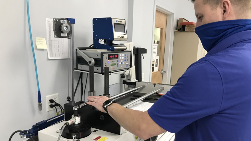 An Essco Calibration Laboratory technician tests a torque wrench. Photo courtesy of Jeff Simon.