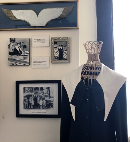 Earhart wore a dress of her own design on her final visit to Atchison, Kansas (replica dress shown with photos from the hometown parade where she wore it). Photo by MeLinda Schnyder.