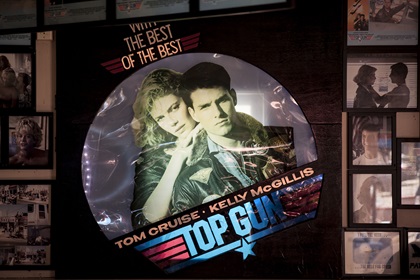 Top Gun memorabilia at Kansas City Barbeque in downtown San Diego, which served as the on-film bar where Maverick and Goose play “Great Balls of Fire” at the piano. Photo by SanDiego.org.