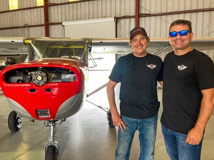 René Asencio and Gilbert Perez stand in front of their 1959 Cessna 150 project. Photo courtesy of Gilbert Perez.