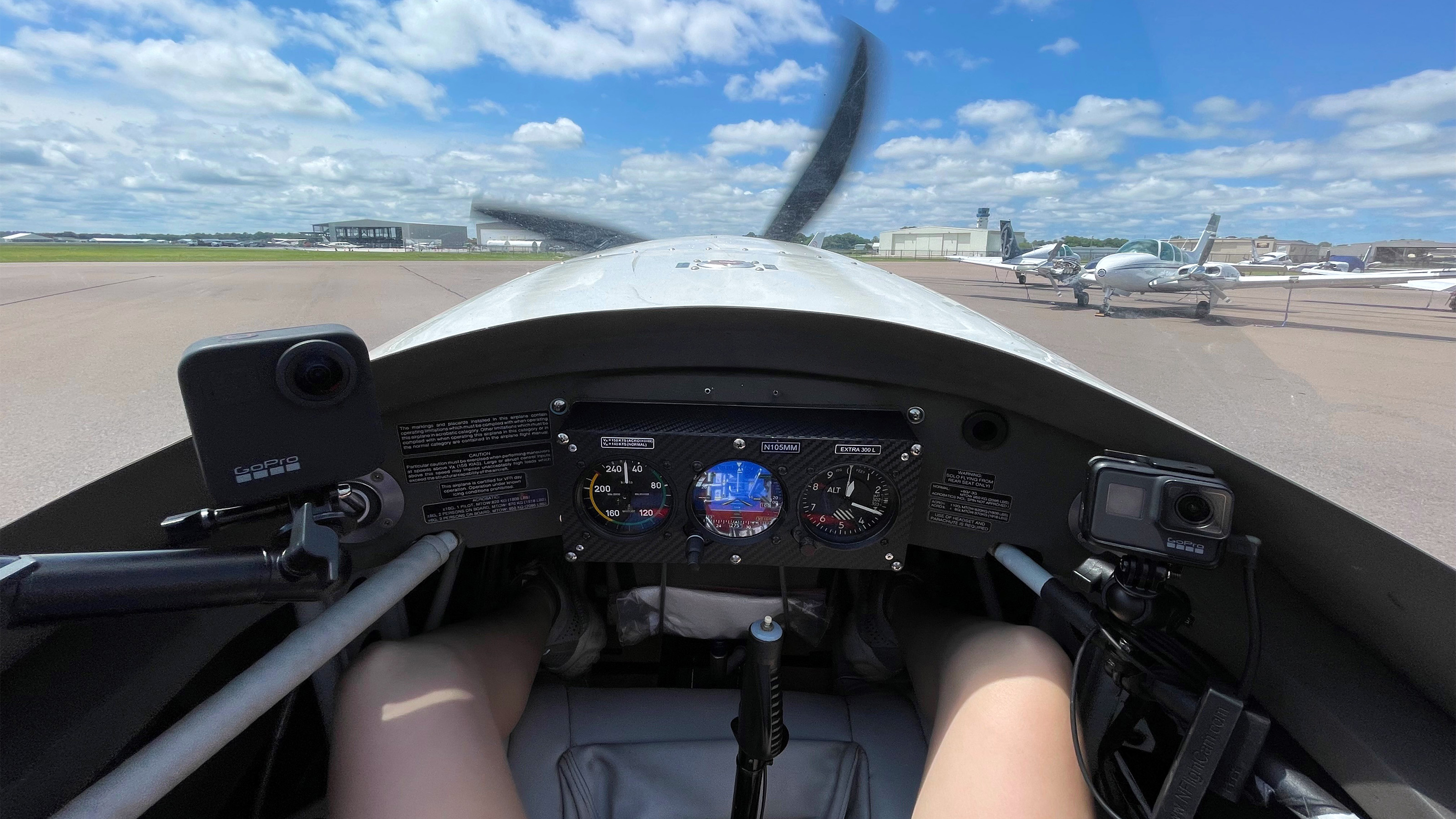 Cayla McLeod strapped into the Extra 300L for a 30-minute flight with Richard McSpadden. Photo by Cayla McLeod. Cayla McLeod strapped into the Extra 300L for a 30-minute flight with Richard McSpadden. Photo by Cayla McLeod.
