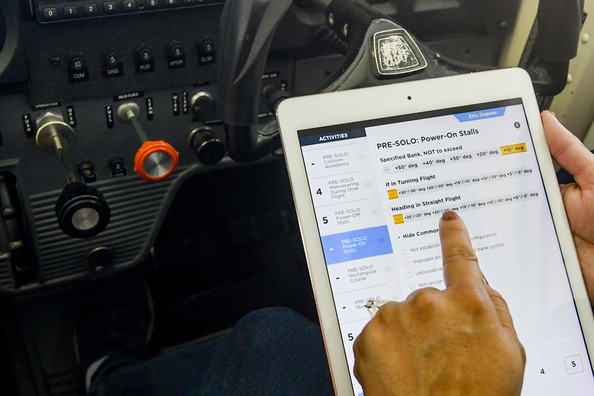 In flight, CFIs can record notes and grade maneuvers, helping them stay organized and informed for future lessons and postflight discussions. Photo by Niki Britton.