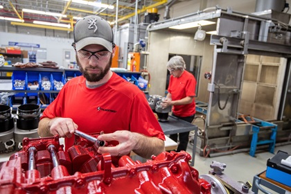 Lycoming Thunderbolt engine makers Zach Smith, foreground, and Tom Wagner at work during a 2019 factory visit. Photo by Mike Collins.