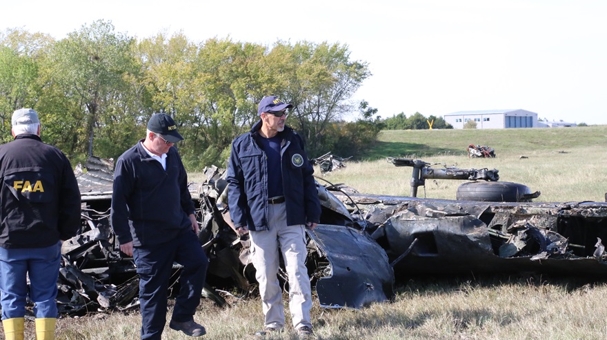 Investigators examine the wreckage of the Boeing B-17. NTSB photo.