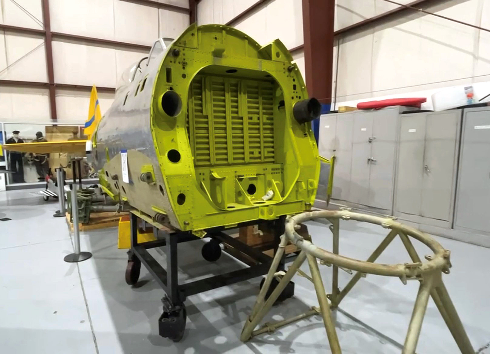 The P–47’s project aircraft sits in the corner of the hangar beside an SBD Dauntless. Photo by Cayla McLeod Hunt.  