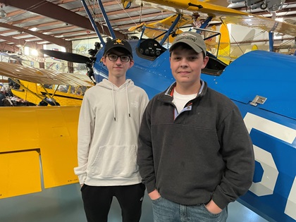 Student pilots Adam Sarsfield, left, and James Frank, both 15, flew their family Super Cubs to Triple Tree. Sarsfield flew with his instructor, Jacob Gates. Frank flew in with his father, Jim Frank. Photo by Cayla McLeod.