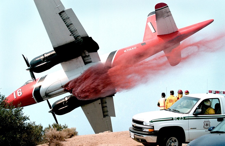 Brent Conner drops retardant along a ridge from a Lockheed SP-2H Neptune in the Angeles National Forest in California. Photo courtesy of Brent Conner.