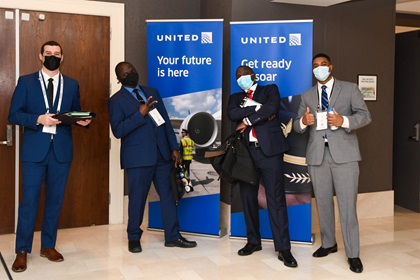 NGPA Industry Expo attendees strike a pose while they await their turn with United Airlines. Photo by Niki Britton.