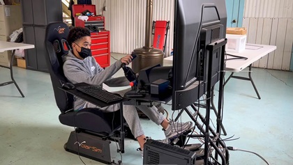 Student Sammy Taylor III spends some time on New Vision Aviation's simulator. Photo by Niki Britton.
