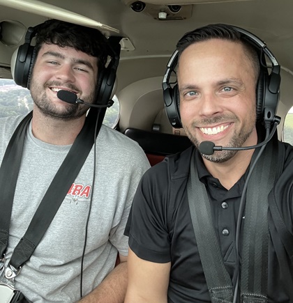 AOPA Social Media Marketer Erick Webb and Parker Thaxton pose for a selfie during Webb’s checkout flight in the AOPA Sweepstakes Cessna 170. Photo by Erick Webb.