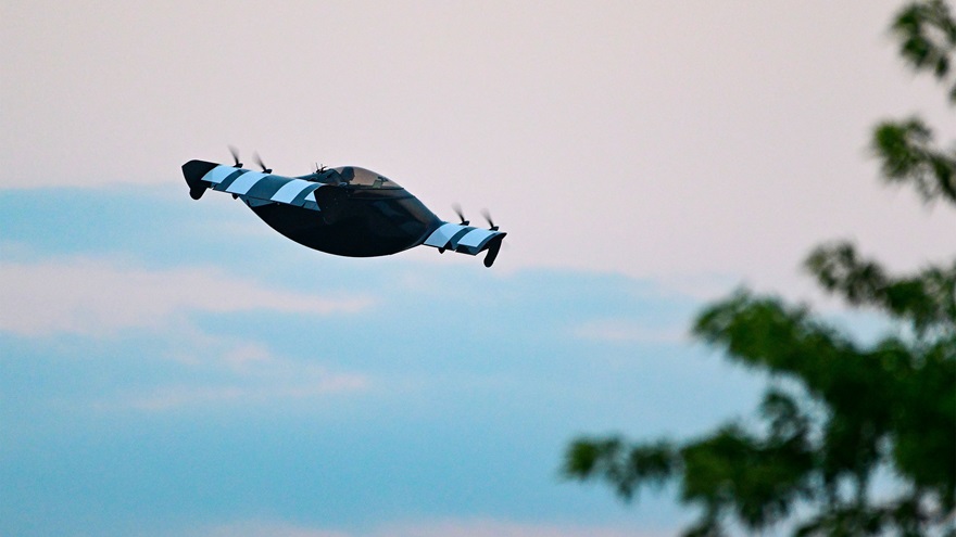 The Opener Black Fly eVTOL performs during the night airshow July 27. Photo by David Tulis.