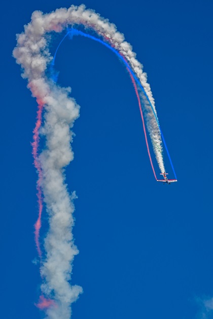 Nathan Hammond performs in a de Havilland Super Chipmunk during the opening day airshow July 25. Photo by David Tulis.