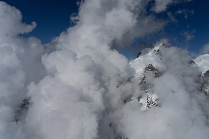 Western side of the Jungfrau (13,642 feet) with towering cumulus. Photo by Garrett Fisher.