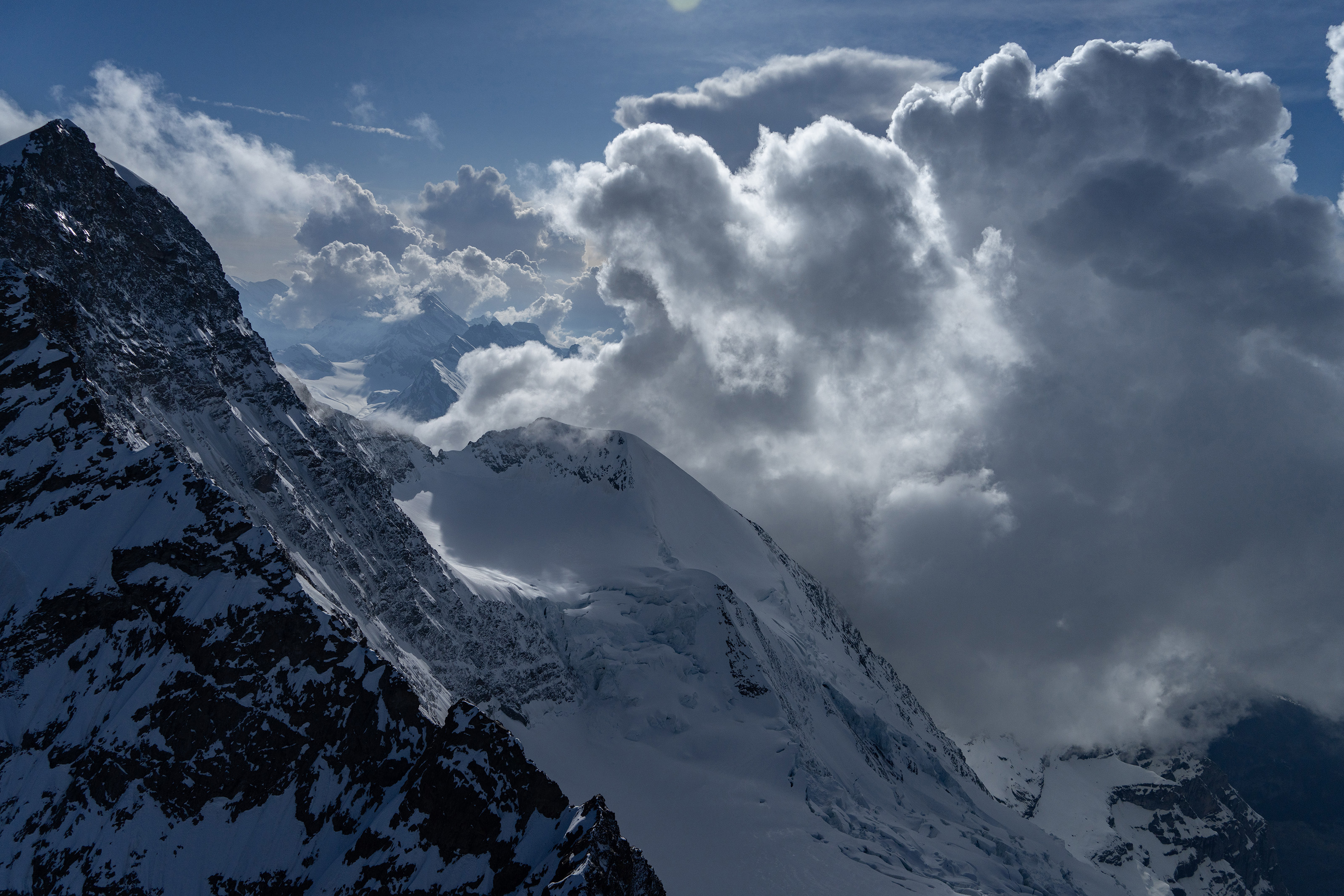 North slope of the Jungfrau, looking back west at developing thunderstorm. Photo by Garrett Fisher.