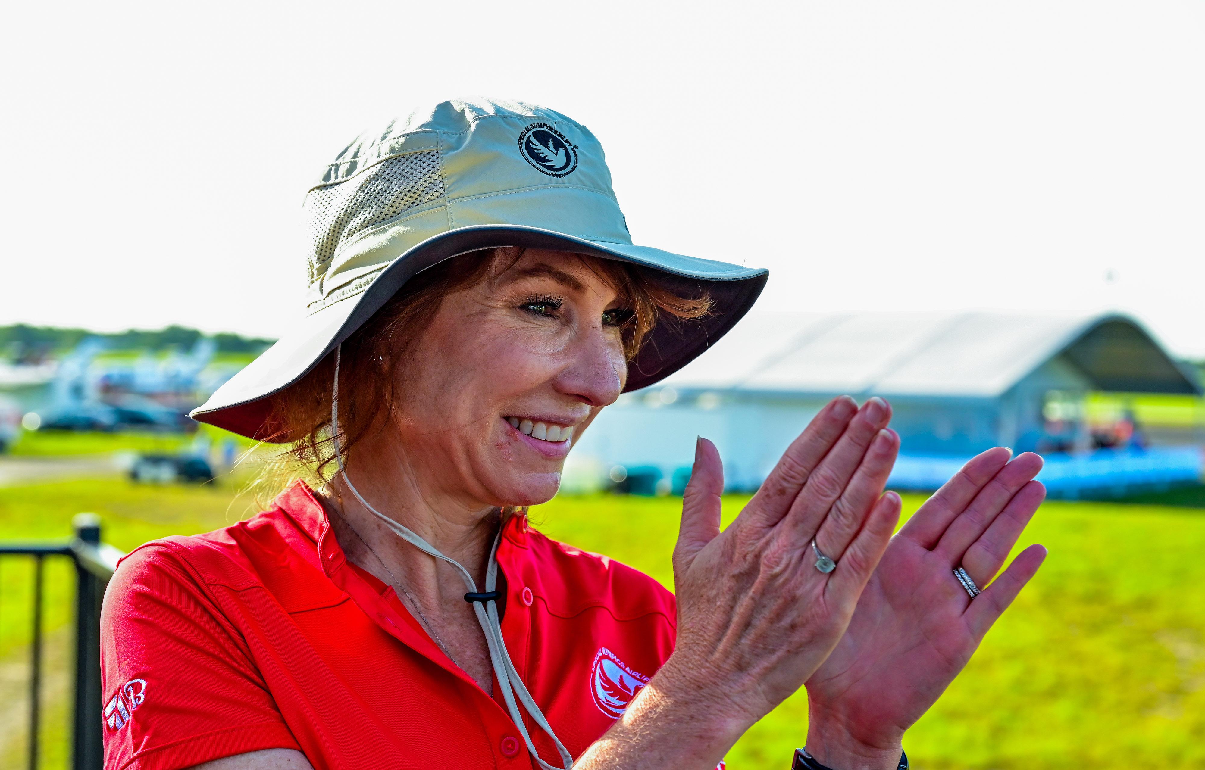 Kriya Shortt, Textron Aviation senior vice president of global parts and programs, applauds Special Olympics USA Games athletes as they depart from Orlando Executive Airport in Orlando, Florida. Photo by David Tulis.