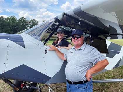 Patriot Aircraft’s Don Wade poses beside AOPA Social Media Marketer Cayla McLeod Hunt after the flight in the Super Patriot. Photo by Ryan Hunt.