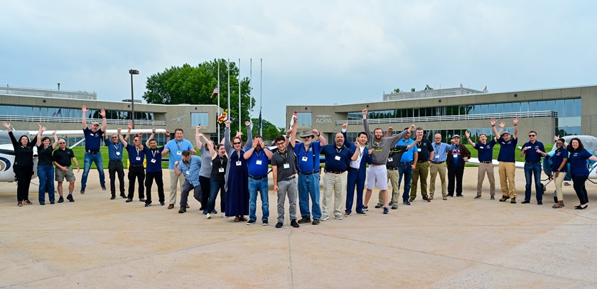 High school educators let loose some pent-up energy after participating in hands-on exercises on the AOPA campus to bolster their understanding of science, technology, engineering, and math skills as they relate to aviation in Frederick, Maryland, June 14, 2022. Photo by David Tulis. 