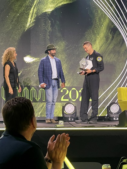 Cyrus Sigari and Anousheh Ansari, founder of the XPrize, recognize Jared Isaacman for his philanthropy and innovation in aviation and space. Photo by Tom Haines.