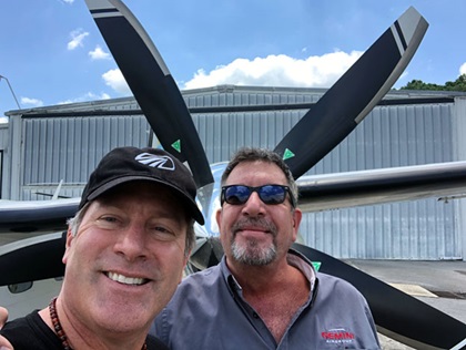 Circumnavigator Robert DeLaurentis (left) is pictured with echanic Rob Louviaux. DeLaurentis has named two $3,000 aviation maintenance scholarships in Louviaux’s honor. Photo courtesy of the DeLaurentis Foundation. 