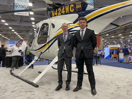MD Helicopters MD-500 transition training scholarship recipients Darren Mudge (left) and Oliver Myers (right) pose for a photo at Helicopter Association International’s Heli-Expo. Photo by Cayla McLeod.