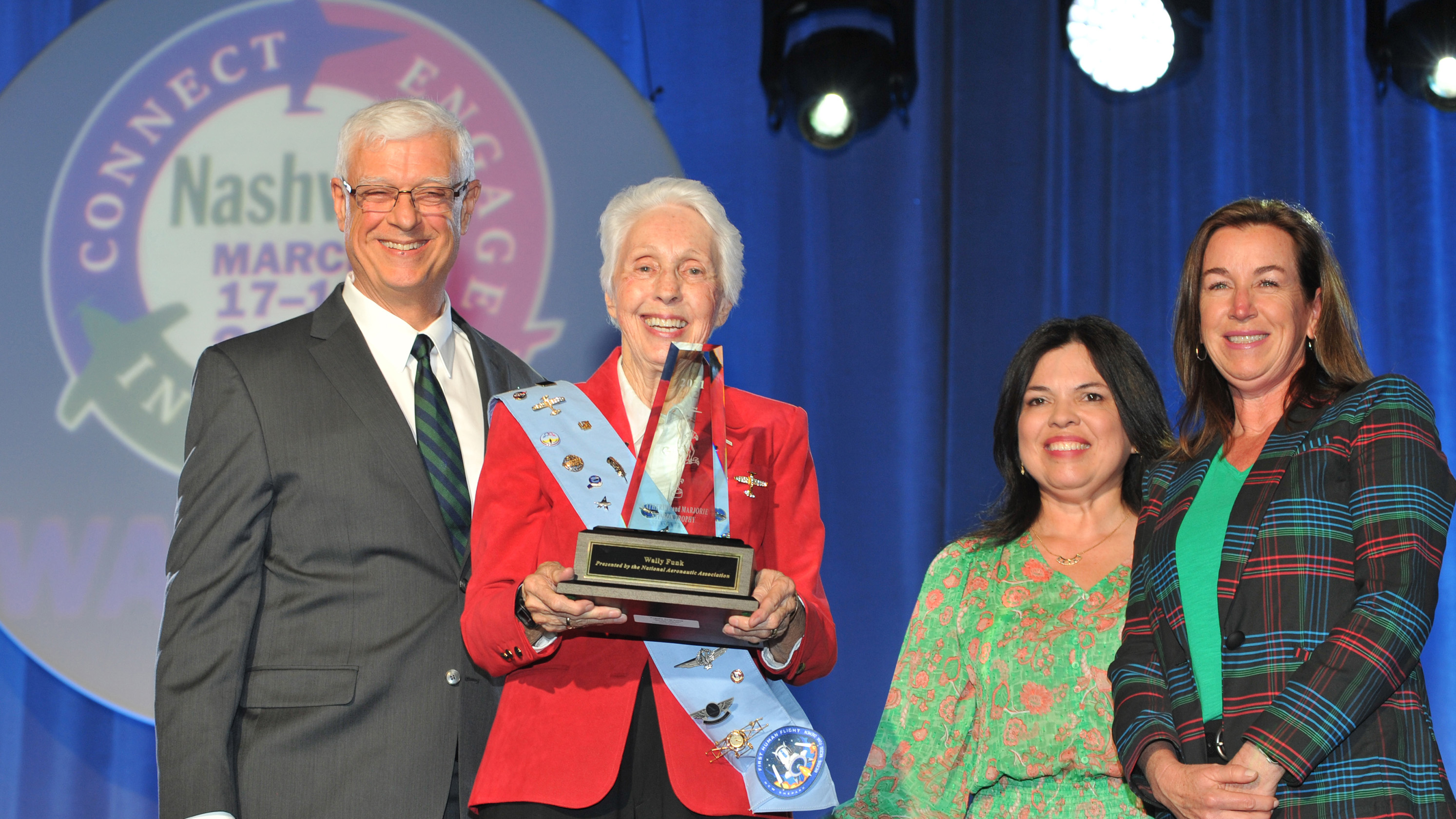 Wally Funk accepted the National Aeronautic Association's 2021 Katherine and Marjorie Stinson Trophy during a ceremony on March 17. Photo by Paula Grubb, courtesy of Women in Aviation International.