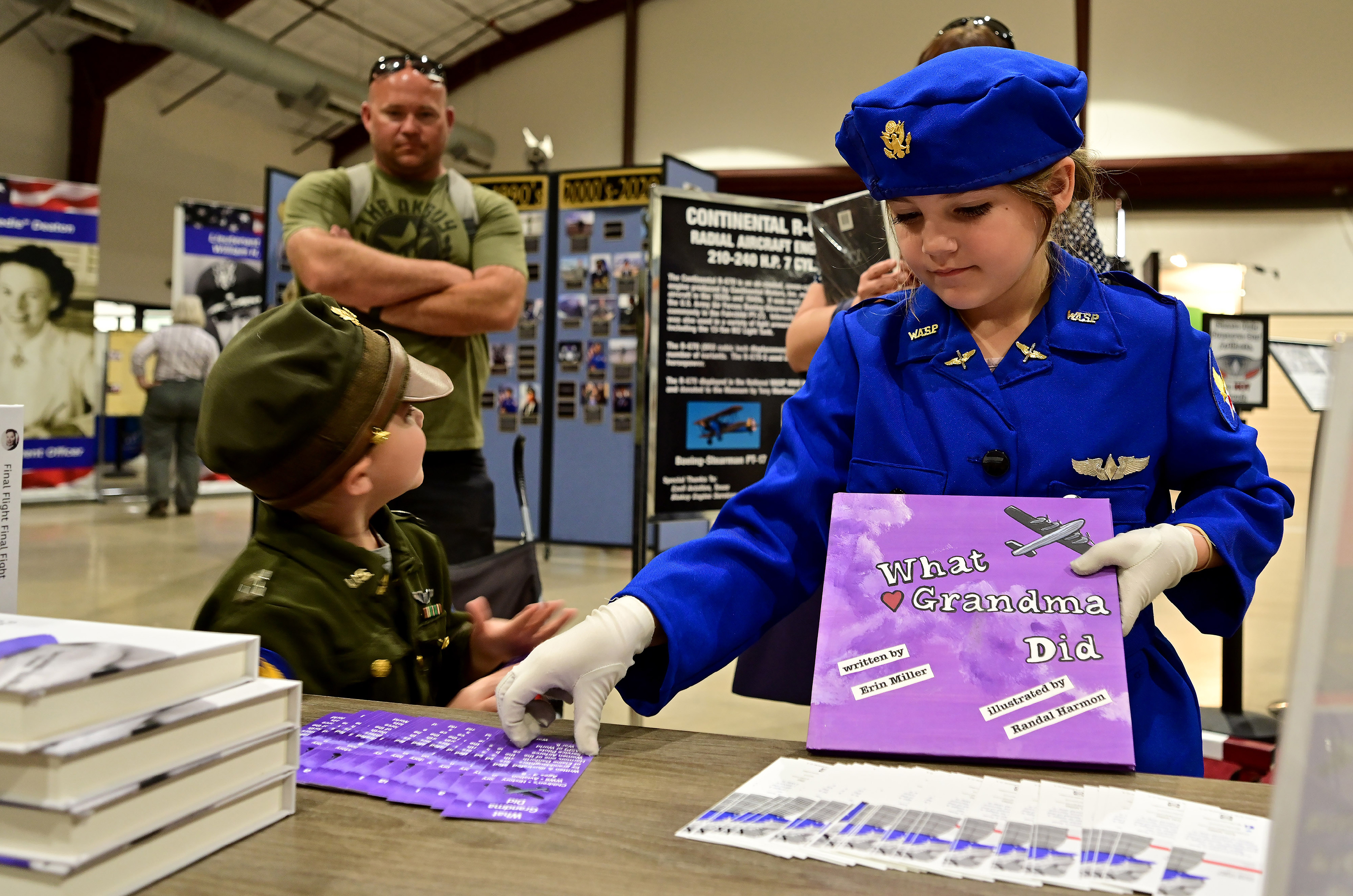 A book for children written by Women Airforce Service Pilots advocate Erin Miller is popular during a fly-in and WASP reunion. Photo by David Tulis.