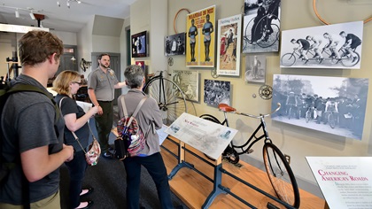 National Park Service Ranger Ryan Qualls shows visitors around a replica of the Wrights' bicycle shop, part of the National Aviation Heritage Area in Dayton, Ohio, in 2019. Photo by Mike Collins.