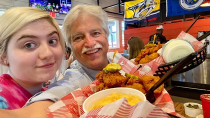 Lauren Tulis and the author sample Nashville hot chicken. Photo by David Tulis.