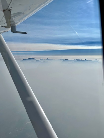 A view of McDonald Peak (9,823 feet msl) above the smoke in western Montana. Photo by Erick Webb.