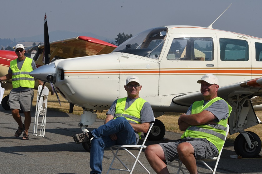 Flight-line volunteers take a short break at the AOPA Hangout at Felts Field in Spokane, Washington, September 9, 2022. Photo by Niki Britton.