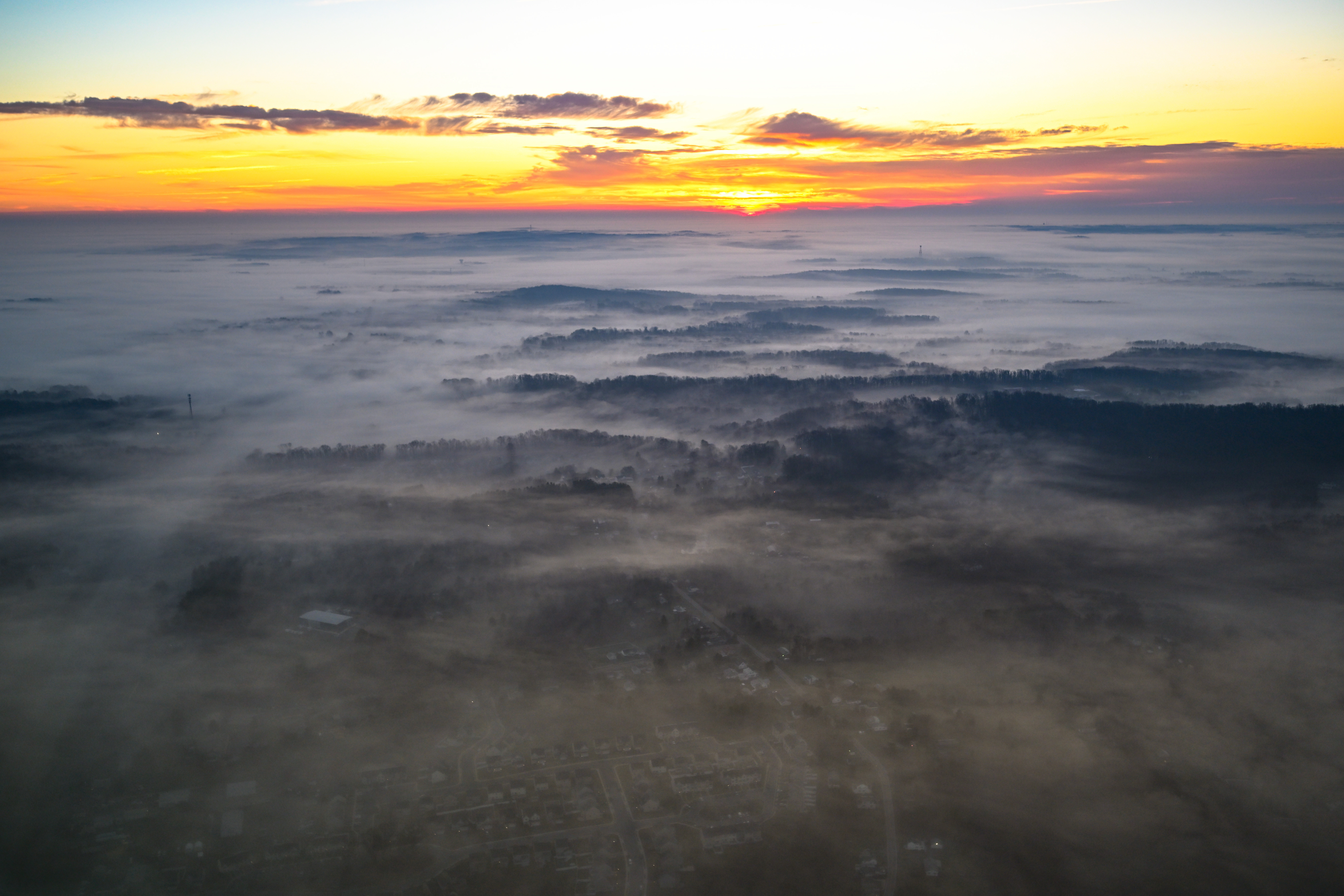 Mist covers the ground during an early morning flight from Maryland's Frederick Municipal Airport to Bay Bridge Airport in Stevensville for the annual Holly Run fly-out. Photo by David Tulis.