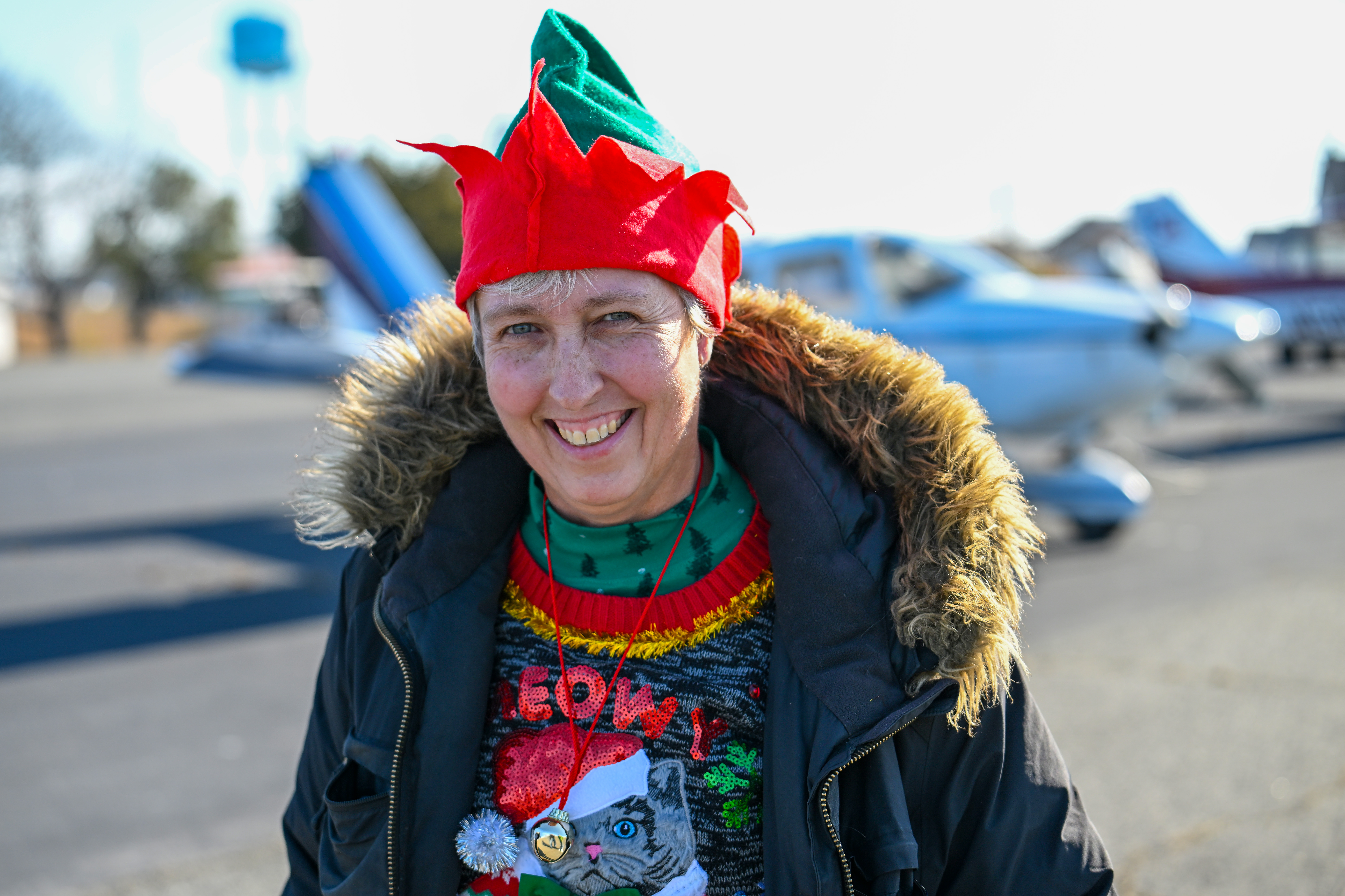 Holly Run organizer Helen Woods arrives at Tangier Island, Virginia, from her home base at Maryland’s Bay Bridge Airport. The annual charity event brings holiday decorations, school supplies, and other necessities to residents. Photo by David Tulis.