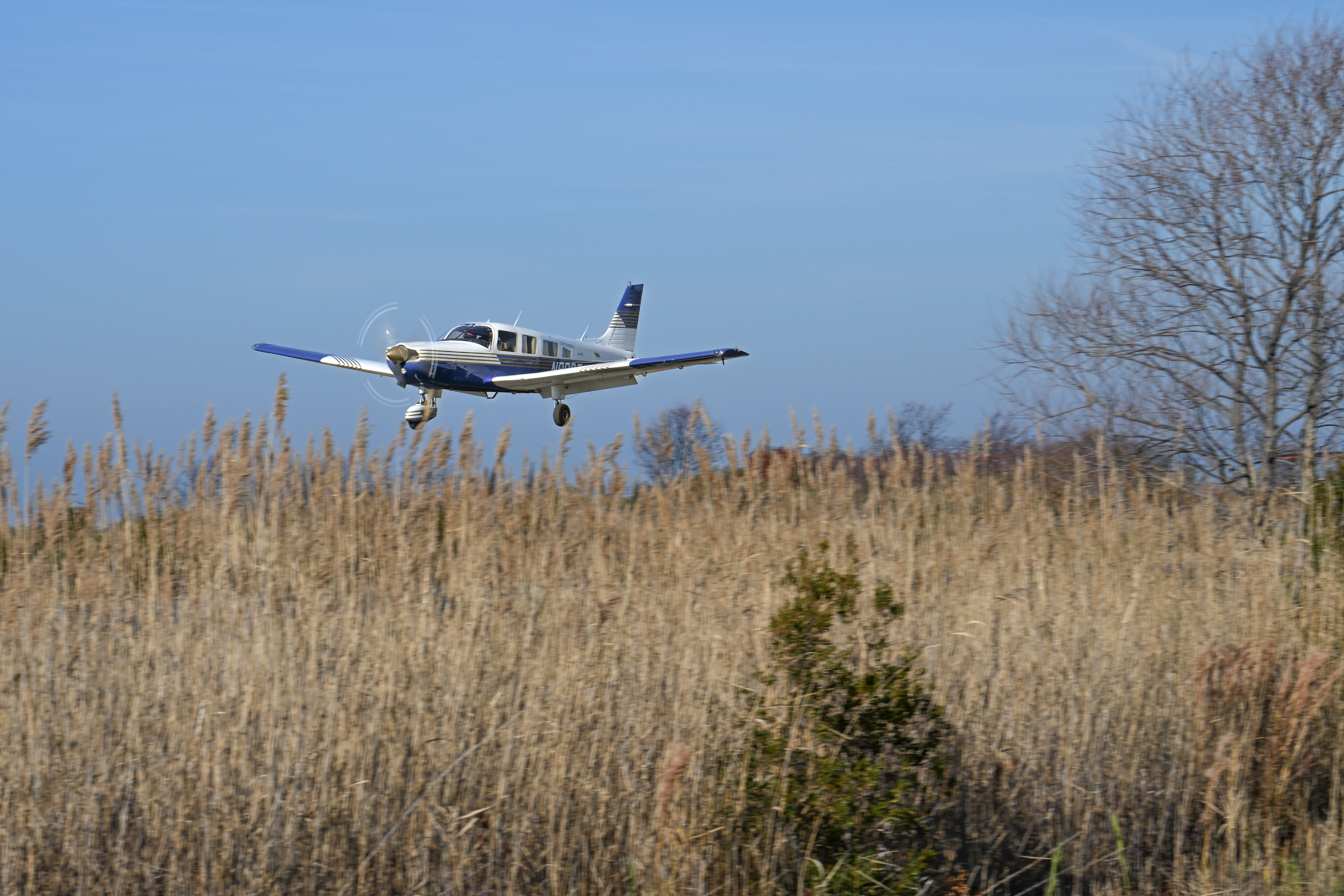 A Piper Saratoga pilot helps deliver holly branches, school supplies, and holiday presents to 400 residents of Tangier Island. Photo by David Tulis.