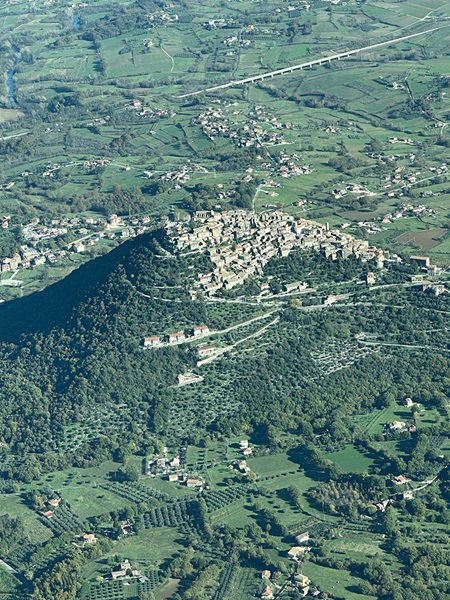 Comune di Castro dei Volsci, province of Frosinone, in west central Italy, from about 2,000 feet. Upper Castro is planted on the mountain and rises about 1,500 feet from the Castro valley in the background. Photo by Mary Michael.