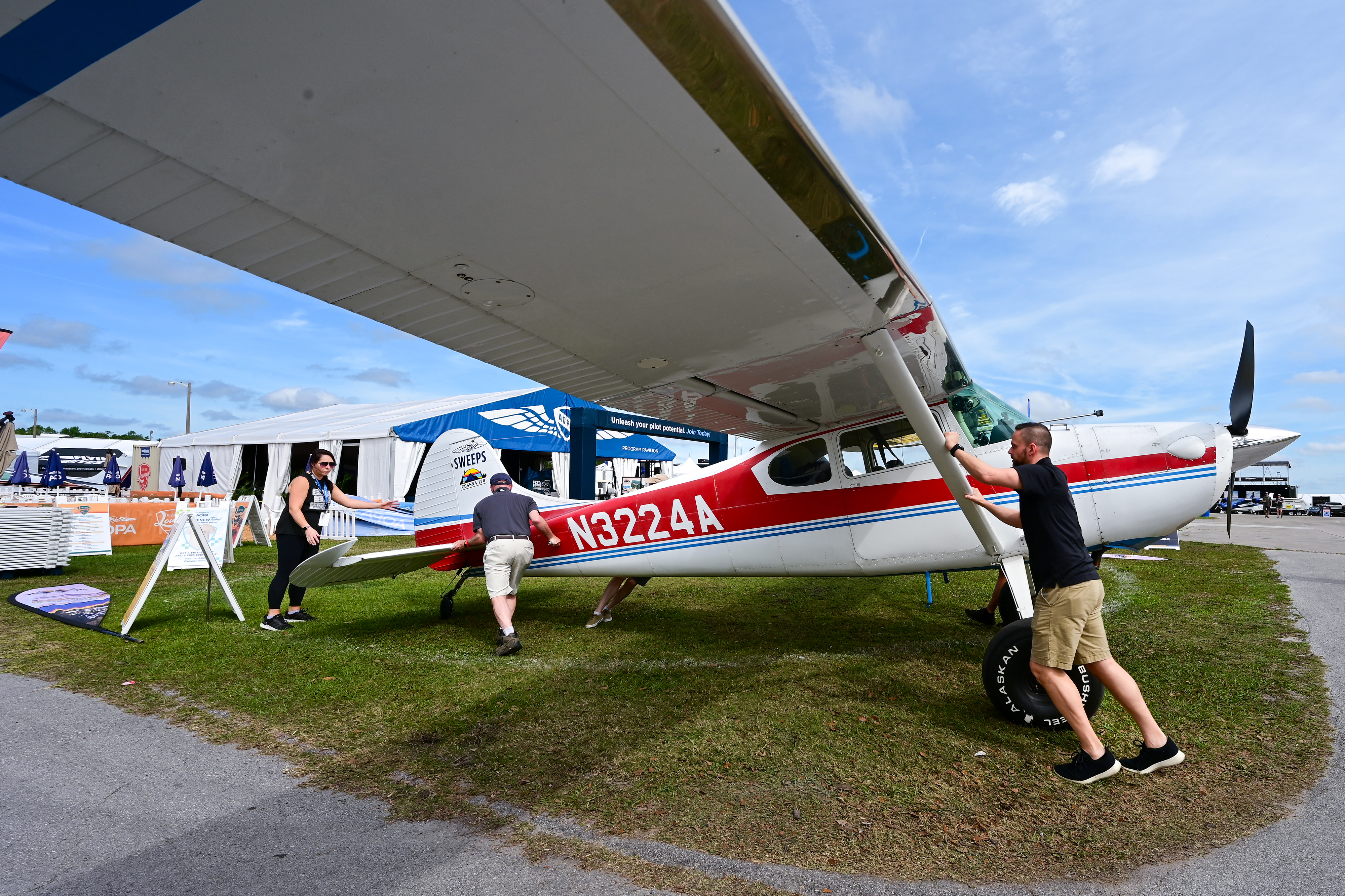 The AOPA Sweepstakes Cessna 170B is moved into position on the AOPA campus during the Sun 'n Fun Aerospace Expo. Photo by David Tulis.