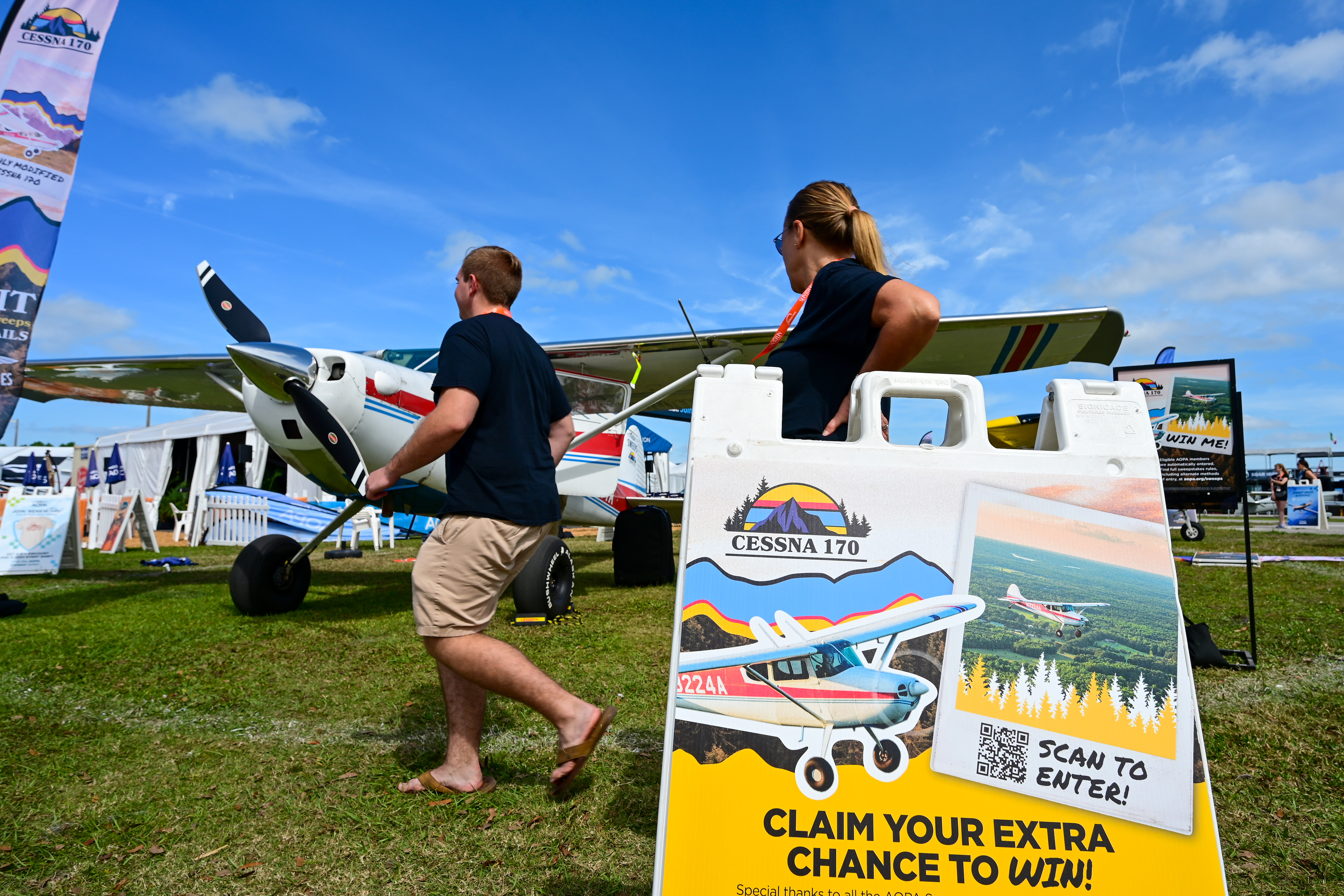 Attendees check out the AOPA Sweepstakes Cessna 170B at the AOPA campus during the Sun 'n Fun Aerospace Expo. Photo by David Tulis.