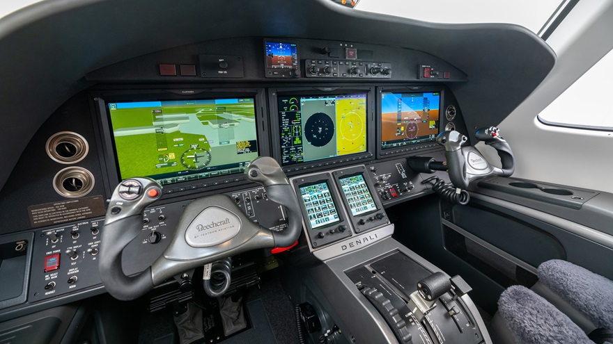 The Garmin G3000 avionics suite in the forthcoming Beechcraft Denali will include Garmin's Autoland system, able to navigate the aircraft to the nearest suitable runway and land automatically after the press of a button, seen here at the top right corner of the panel, just below the glareshield. Photo courtesy of Textron Aviation.