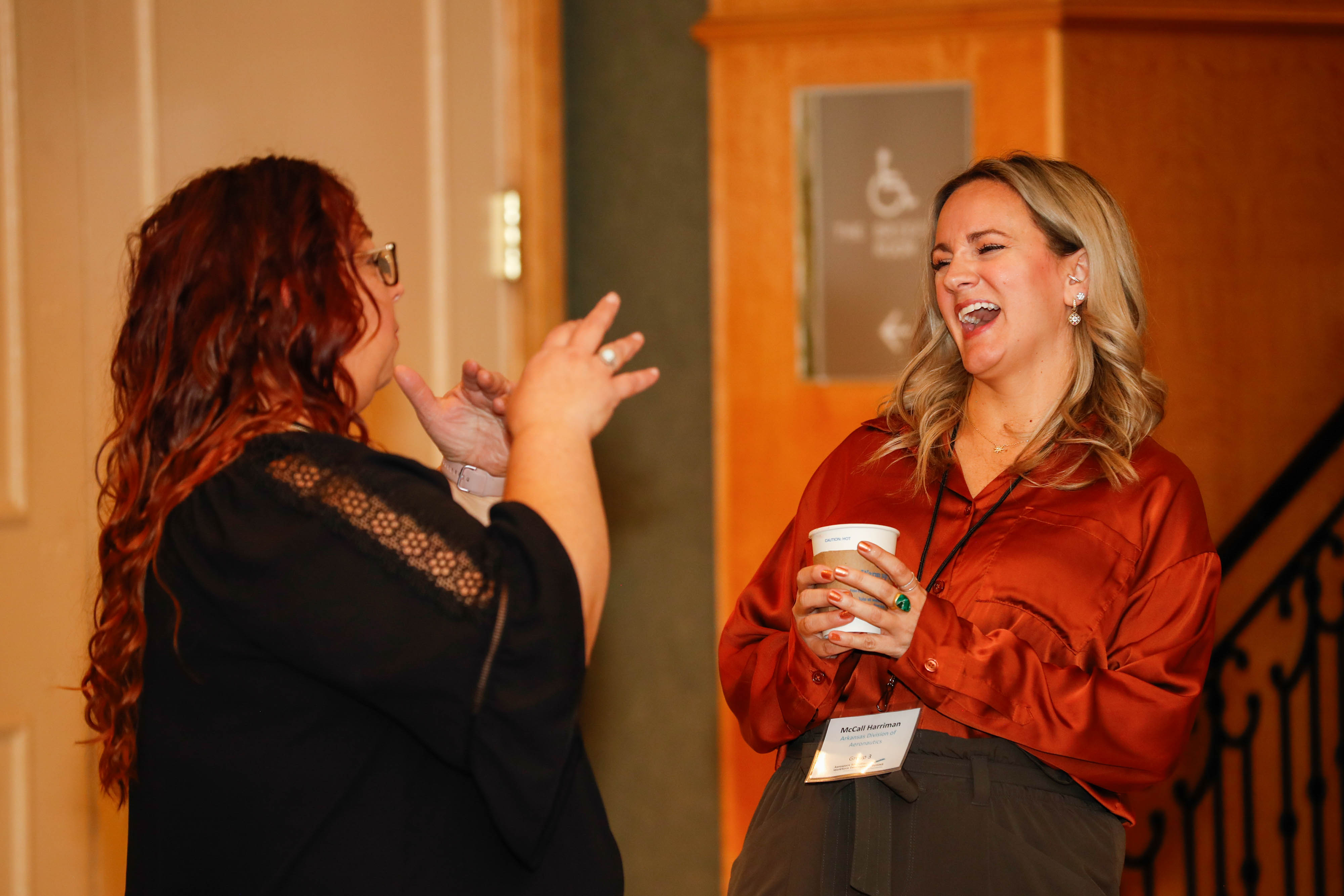 McCall Harriman from the Arkansas Division of Aeronautics shares a laugh with Michelle Bouziden from the Oklahoma Department of Aerospace and Aeronautics at the AOPA Foundation High School Aviation STEM Symposium in Orlando, Florida, on November 12. Photo by Rebecca Boone.