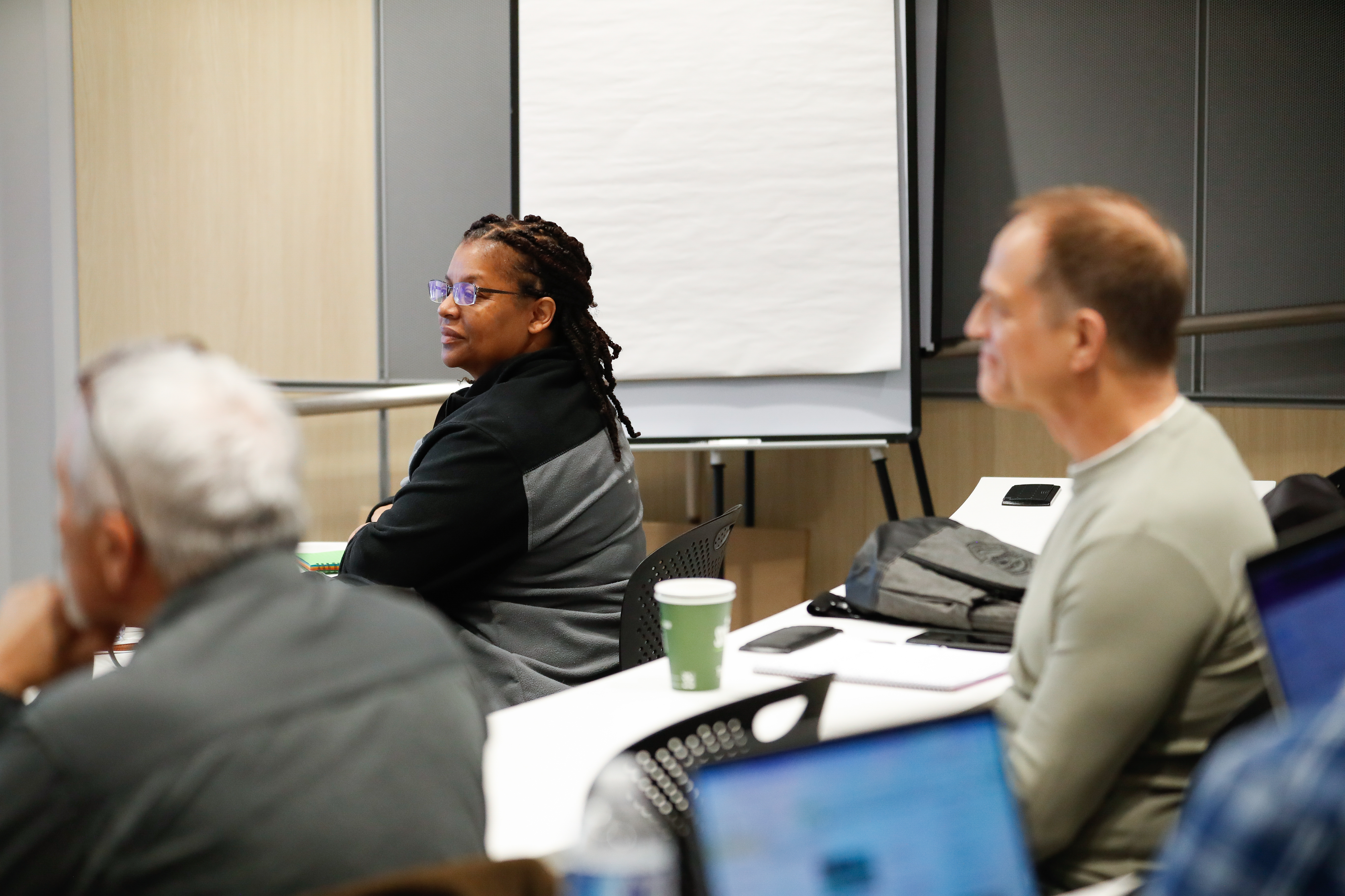 High school educator Carol Curtis listens intently along with the other teachers during a lecture. Photo by Rebecca Boone.