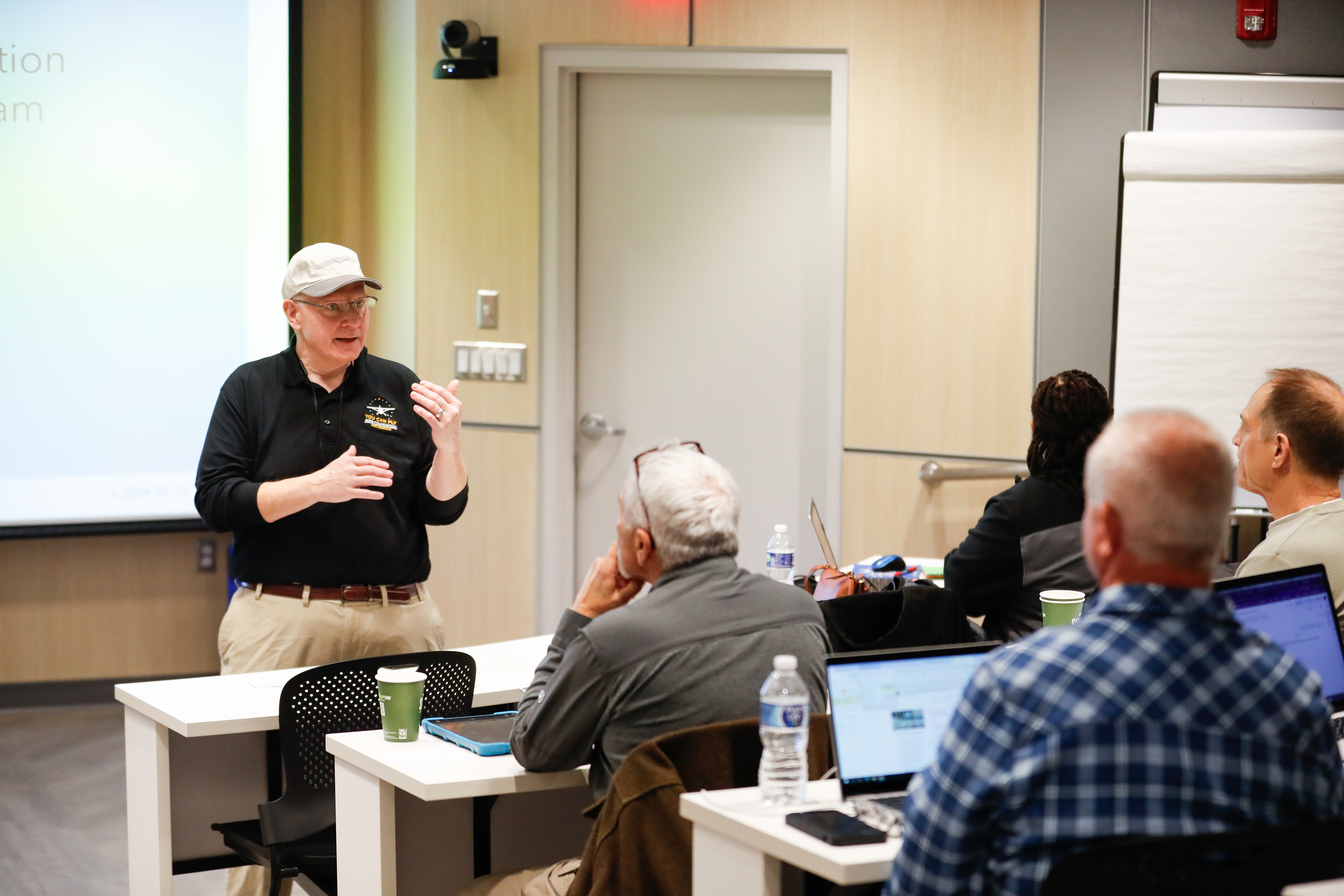 Glenn Ponas, AOPA director of high school outreach, addresses the teachers during a workshop at the AOPA campus to help teach science, technology, engineering, and math skills related to aviation. Photo by Rebecca Boone.