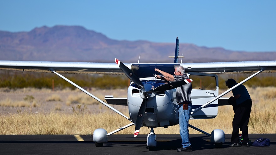 A Cessna 182 is preflighted by Mexico Medical Missions pilot Mike Berkeley and his wife, Maci, at Presidio Lely International Airport in the Big Bend area of West Texas December 20, 2021. Photo by David Tulis.