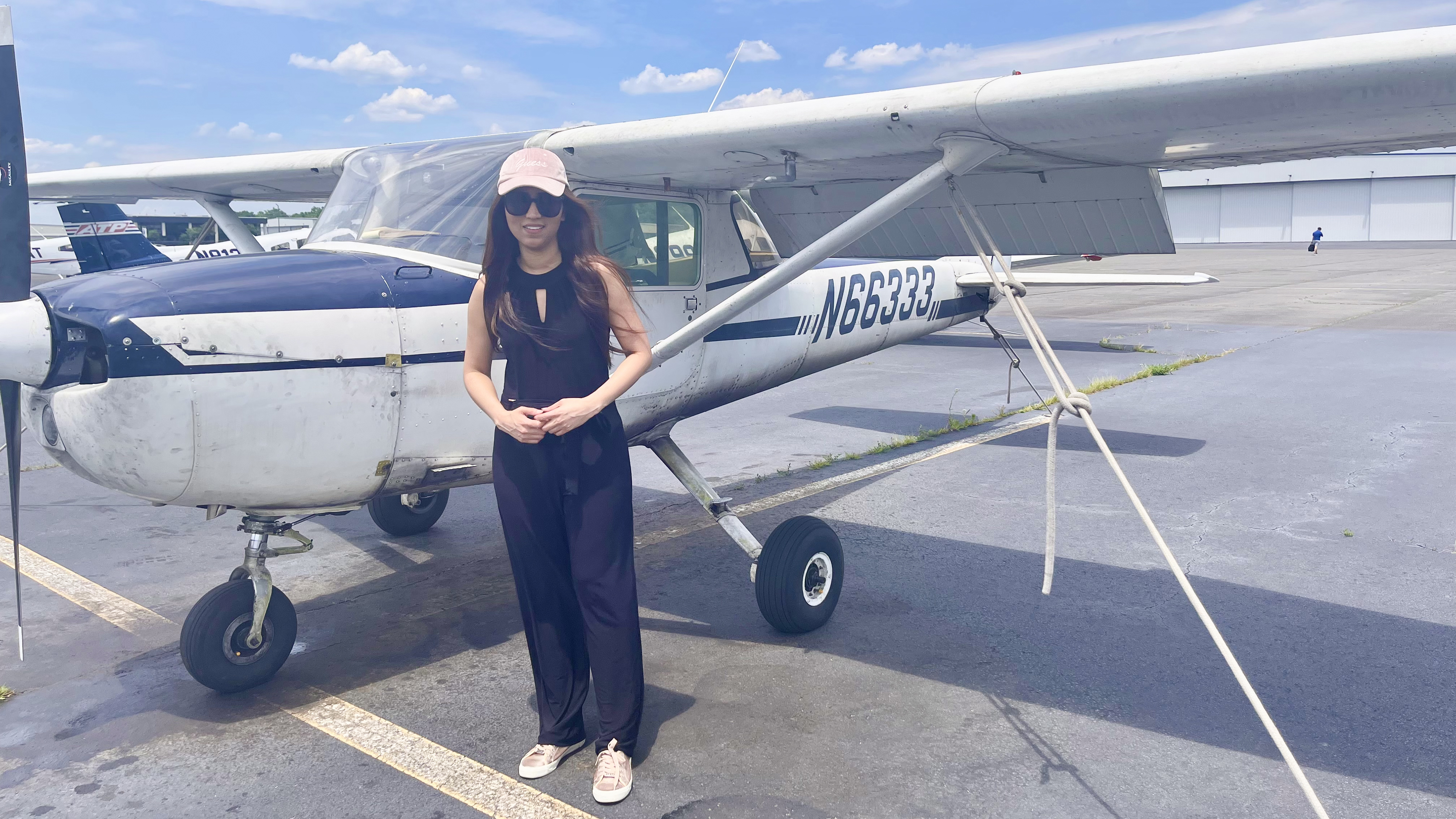 Thida Aung, pictured here with an American Aviation aircraft, said she was surprised when the school abruptly closed August 1. Photo courtesy of Thida Aung.
