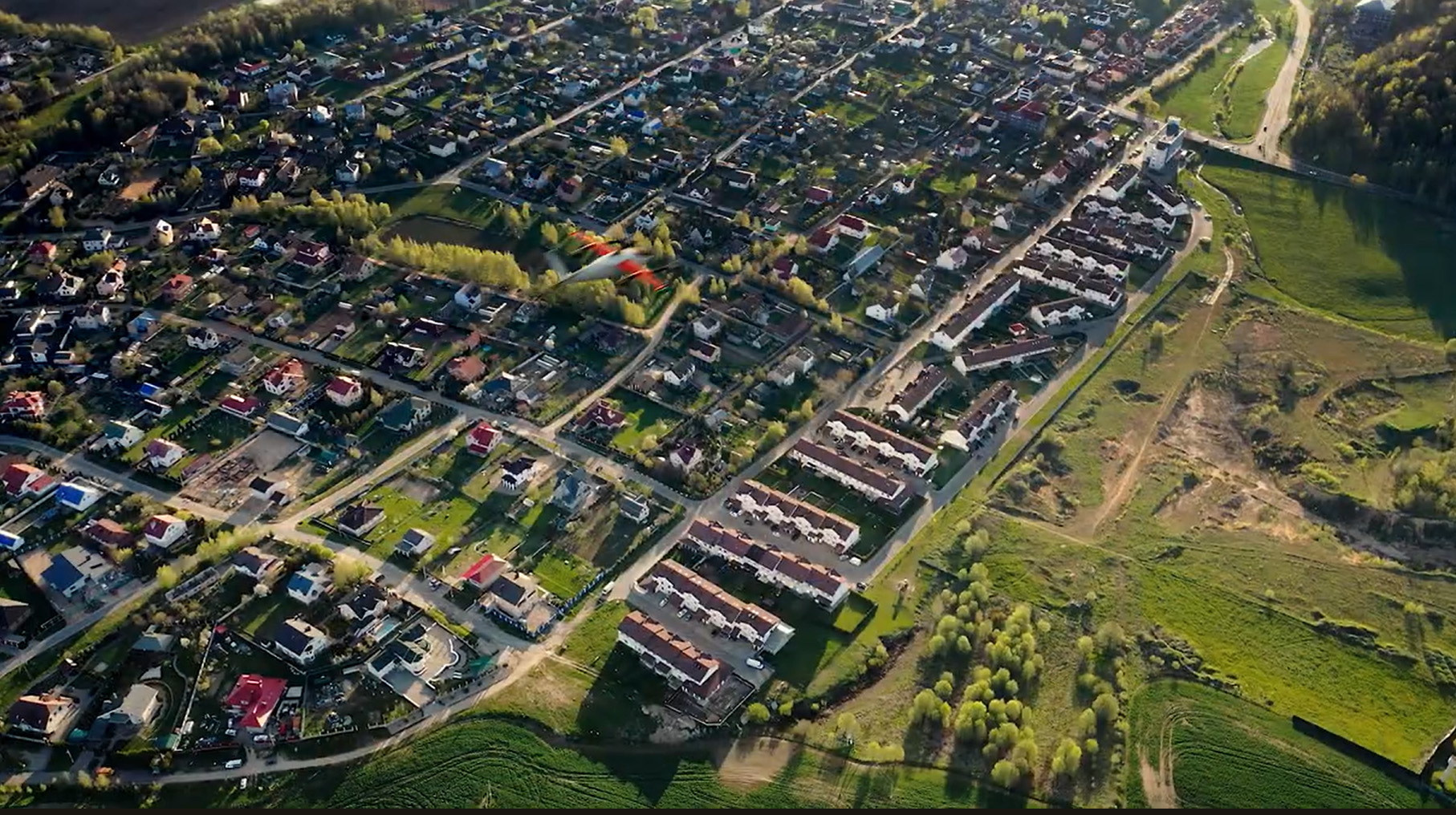 This image from a YouTube video posted by Zipline International in 2023 depicts one of the company's delivery drones en route to a suburban delivery. Image courtesy of Zipline International.